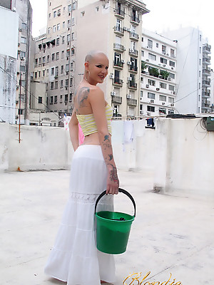 TS Blondie Johnson with her head shaved up on the rooftop